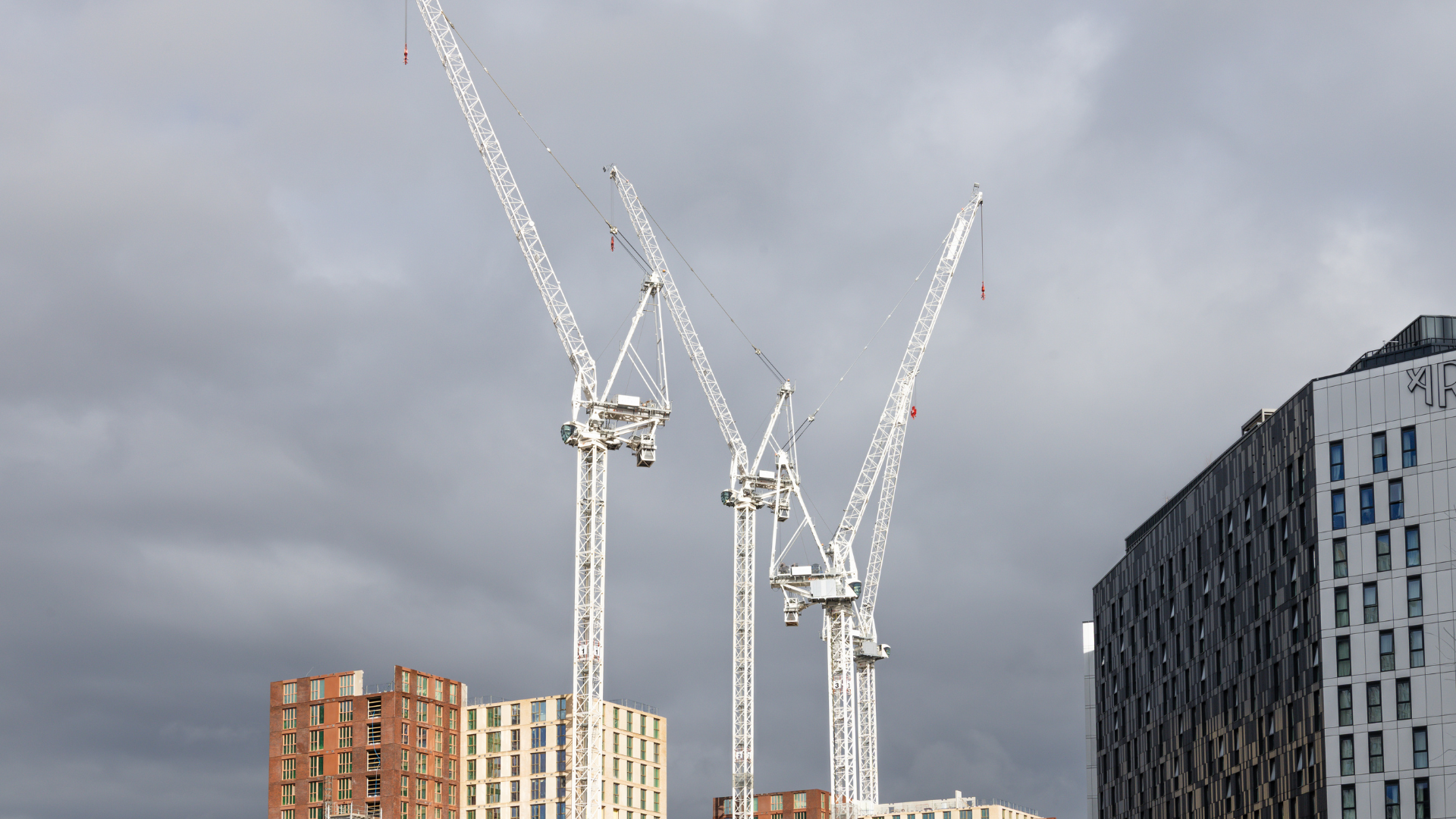 Urban Development with Tower Cranes Above City Buildings. London